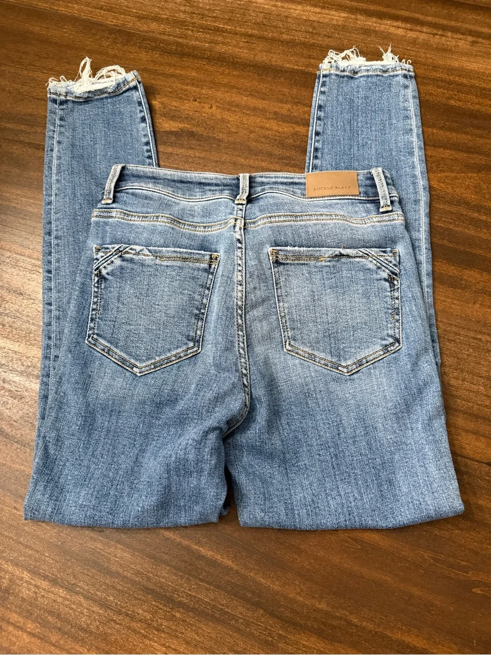 Buckle Faded Blue Skinny Jeans with Raw Hem - Picture 7 of 9